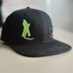 musta värvi vikatimehe logoga helly hanseni nokamüts